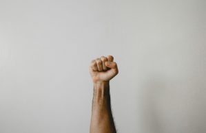 Man with fist clenched in protest